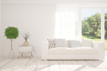 Stylish room in white color with sofa and summer landscape in window. Scandinavian interior design. 3D illustration