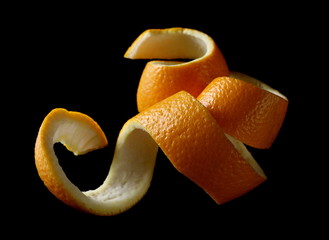 Orange peel isolated on black background