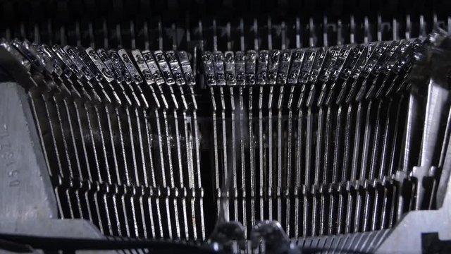 Keys hitting while typing in an old qwerty typewriter