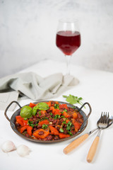 Healthy vegetarian meal of steamed vegetables. Red beans, paprika, tomatoes and greens stewed in tomato sauce. Traditional Caucasian dish - lobio.