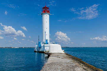 Fototapeta na wymiar Seascape with lighthouse on the Black Sea in Odesa during the summer season