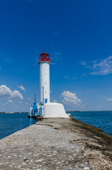Fototapeta na wymiar Seascape with lighthouse on the Black Sea in Odesa during the summer season