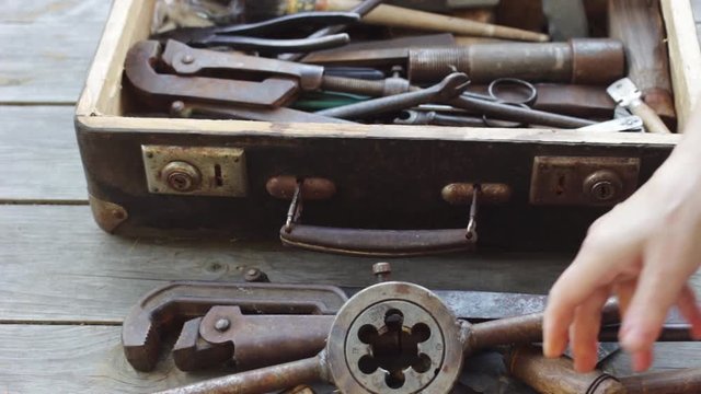 Old suitcase with different hand tools