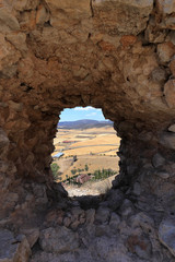 Stone window overlooking the Spanish Manchego countryside