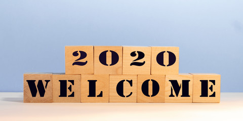 Welcome 2020 on wood blocks