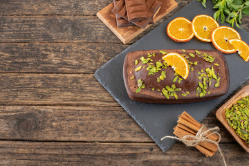 Cake with chocolate , cocoa , flour and hazelnut on the wooden table