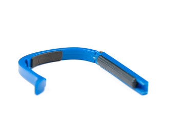 Blue guitar capo isolated on white background.Copy space