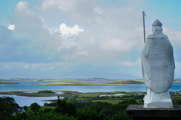 Saint Patrick Statue looking after the valley on Croagh Patrick, Mayo, Ireland