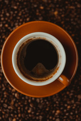 Obraz na płótnie Canvas Coffee cup and beans background