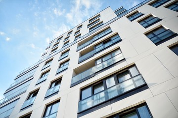 Modern and new apartment building. Multistoried modern, new and stylish living block of flats.