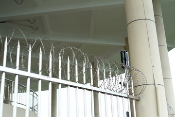 barbed wire fence with an alarm installed, photographed at an aerial navigation tower in shenzhen china