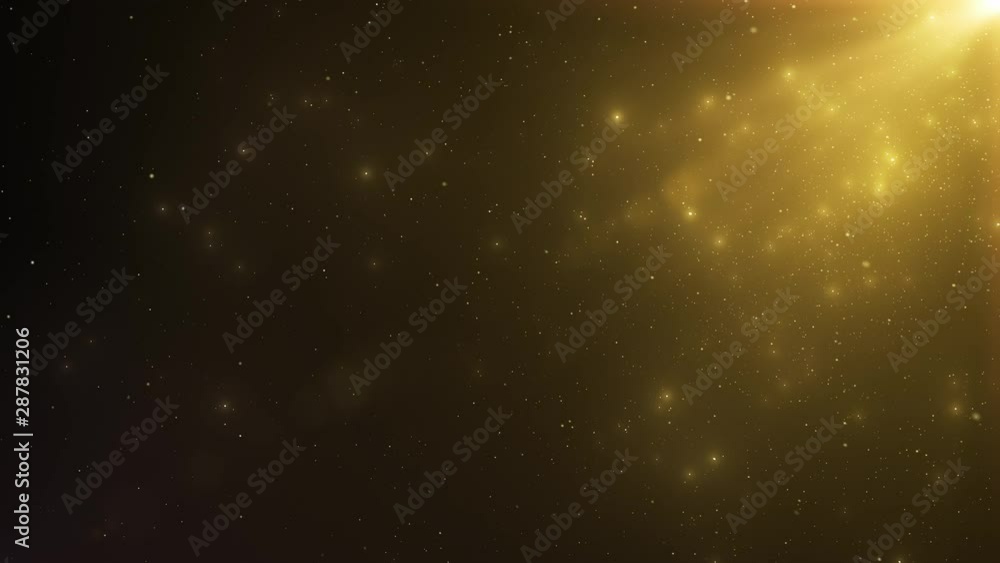 Poster abstract background of sparkling floating golden dust particles and rays of light on an isolated bla