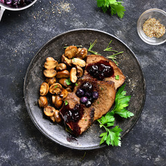 Slow cooked beef with mushrooms and blueberry sauce