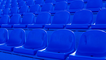 Bleachers in a sports stadium. Blue Seats In A Row