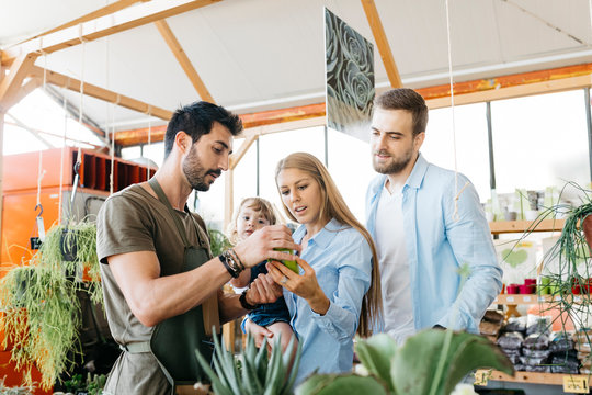 Shop assistant in a garden center advising customers