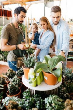 Shop assistant in a garden center advising customers
