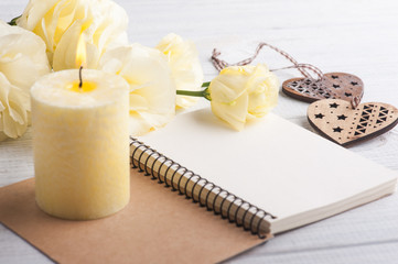notebook with yellow lisianthus flowers