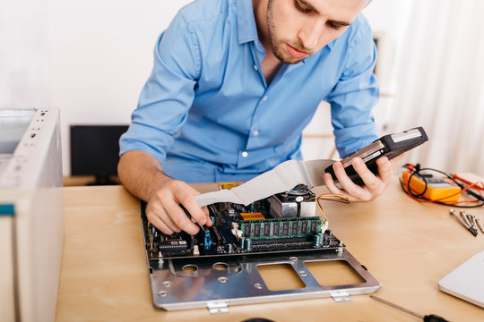 Technician repairing a desktop computer