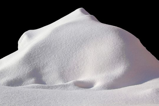 Huge Pile of snow isolated on black