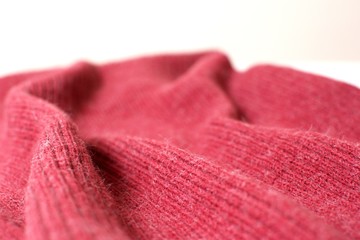 Bordeaux colored piece of cloth against a light background