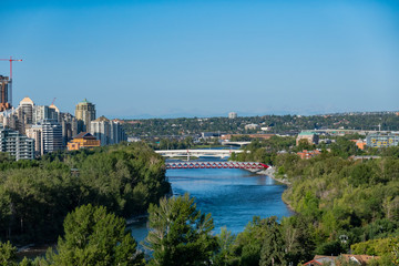 Naklejka premium Morning aerial view of the famous red Peace Bridge and downtown cityscape