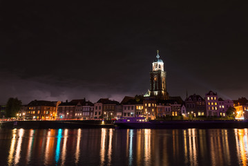 Fototapeta na wymiar View of the river IJssel and Maria Church in Deventer, Netherlands at night