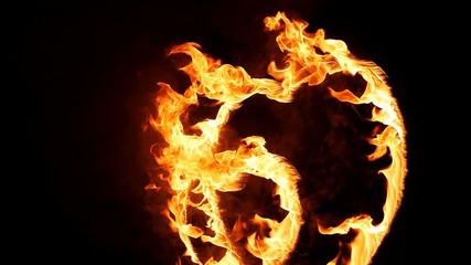 entertainment, fire performance, valentine day concept. on the metal support there is a big heart that all burning bright and smoking in the dark of night