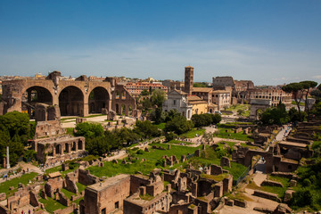 View of the ancient ruins of the Roman Forum and the Colosseum in Rome