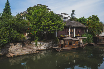 Fototapeta na wymiar Chinese houses and boats in old town of Nanxun, China