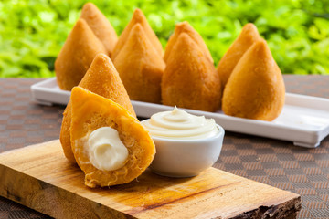 Brasilian snack coxinha, dried meat with cheddar