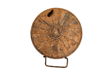 An old rusty world war II anti-tank mine. German anti-tank mine Tmi-35. On white isolated background.