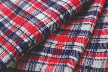 Red, blue and white tartan patterned cloth.