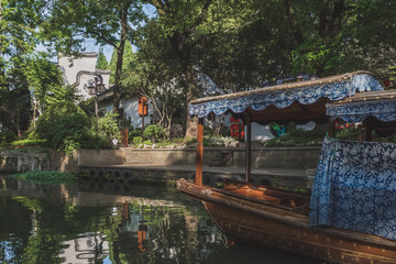Fototapeta na wymiar Boat on river in the old town of Nanxun, Zhejiang, China
