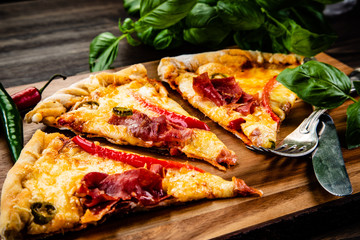 Pizza with smoked ham and pepper