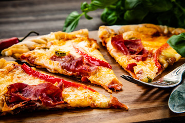 Pizza with smoked ham and pepper