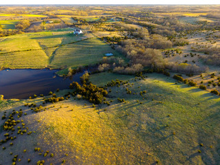 Nebraska countryside landscape trees, water, and sky with clouds