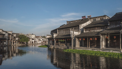 Fototapeta na wymiar Chinese architecture by river in old town of Nanxun, China