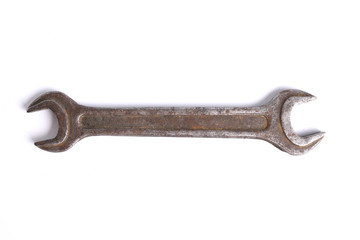 Old rusty stainless steel crescent wrench isolated on white top view