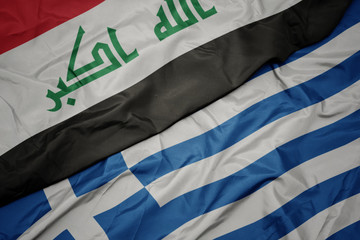 waving colorful flag of greece and national flag of iraq.