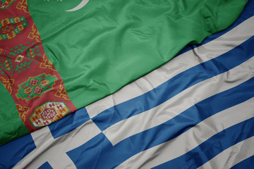 waving colorful flag of greece and national flag of turkmenistan.
