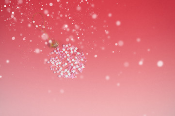 Colorful sprinkles on a pink background, top view with copy space