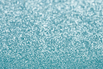 Abstract blue glitter background. Sparkle blue bokeh christmas background.