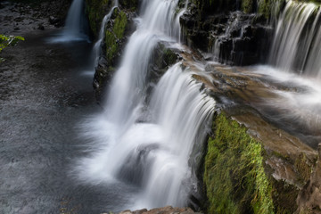 Fototapeta na wymiar Long exposure shot of waterfall, in the Brecon Beacons, Wales scenic waterfall with flowing water