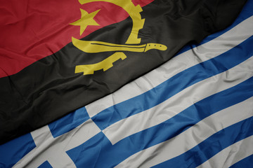 waving colorful flag of greece and national flag of angola.