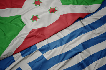 waving colorful flag of greece and national flag of burundi .