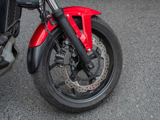 Obraz premium Red and Black Motorbike Wheel - Close Up