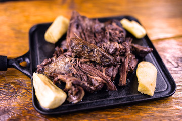 Pork rib meat on plate with potatoes. Typical food of Minas Gerais, Brazil.