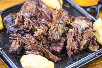 Pork rib meat on plate with potatoes. Typical food of Minas Gerais, Brazil.