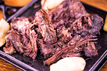 Pork rib meat on plate with potatoes. Typical food of Minas Gerais, Brazil.