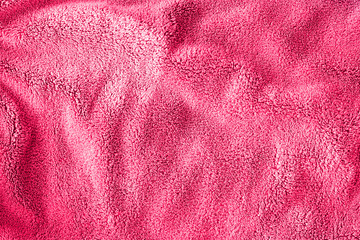 Pink delicate soft background of fur plush smooth fabric. Texture of light red soft fleecy blanket textile. Girly wallpaper © lusyaya